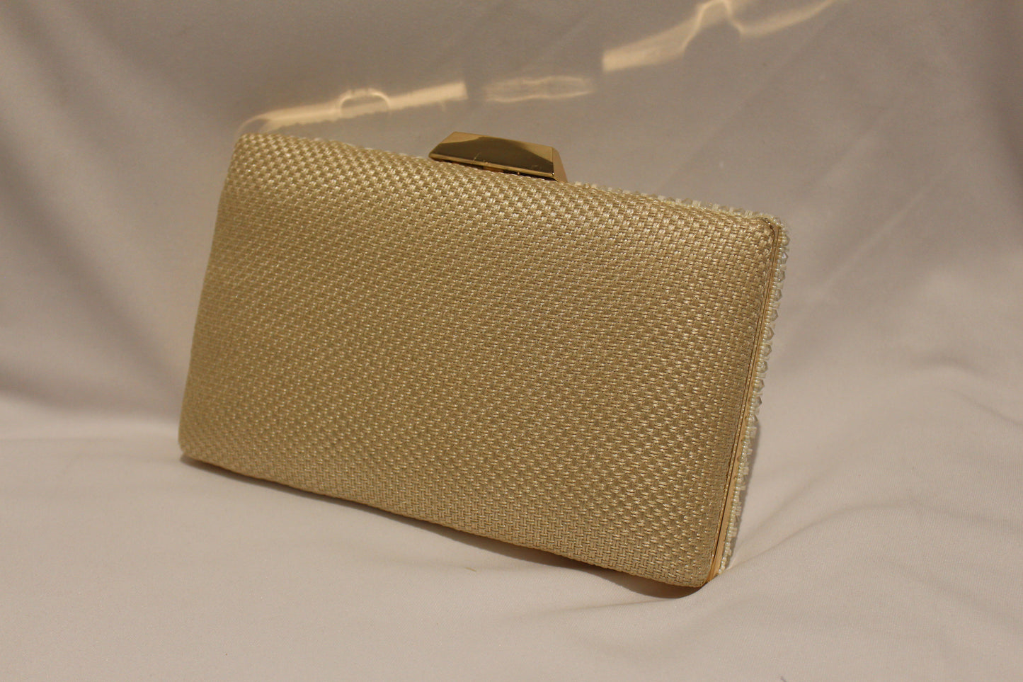 white clutch with handle and sling