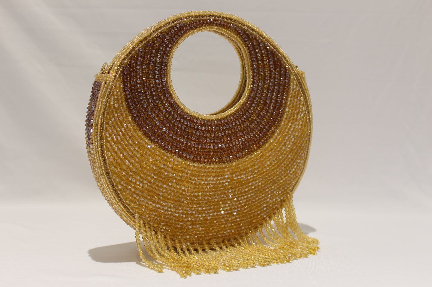 Round shaped golden clutch