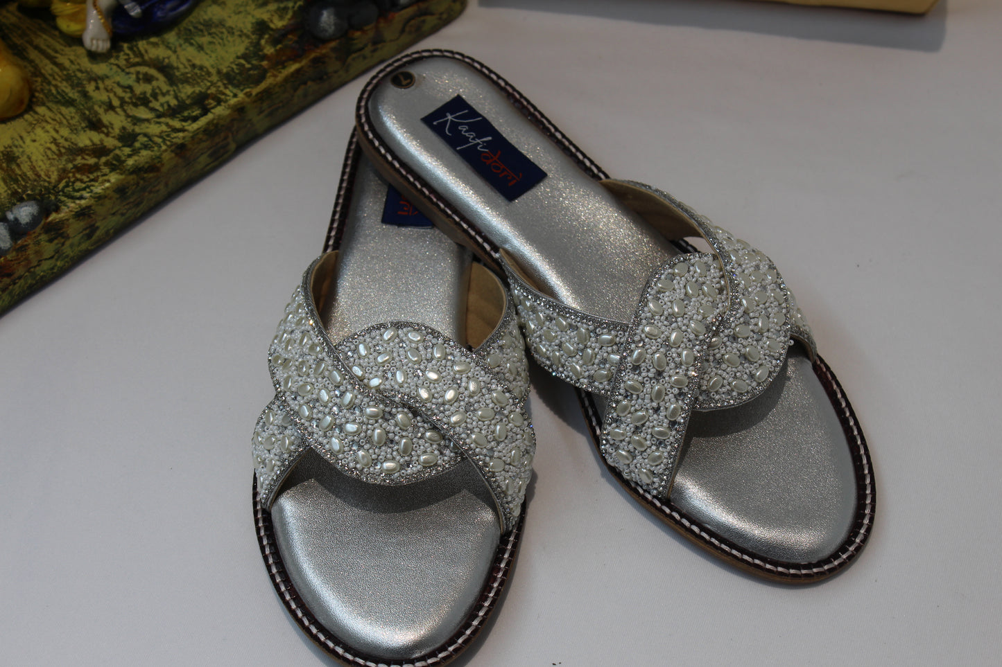 Silver flats by Kaafi Dori
